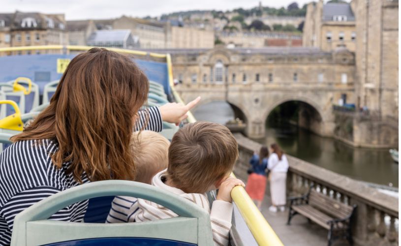 woman and child on open top bus